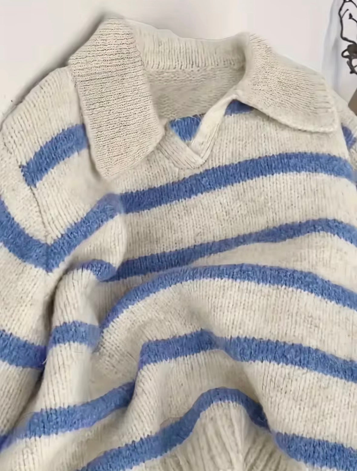 Gestreifter Strickpullover mit Polokragen